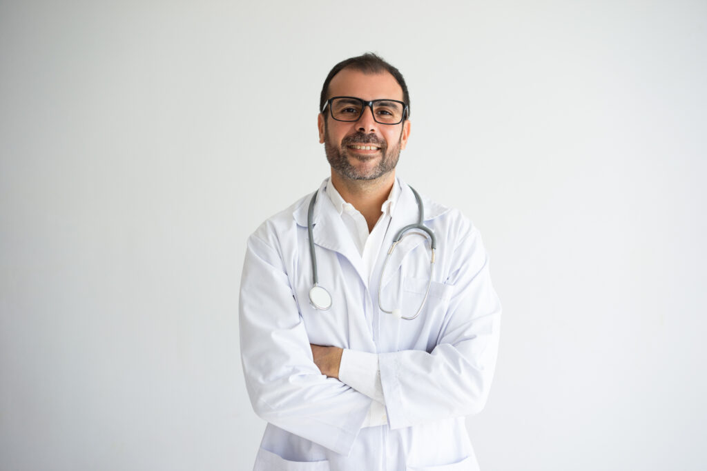 portrait successful mid adult doctor with crossed arms